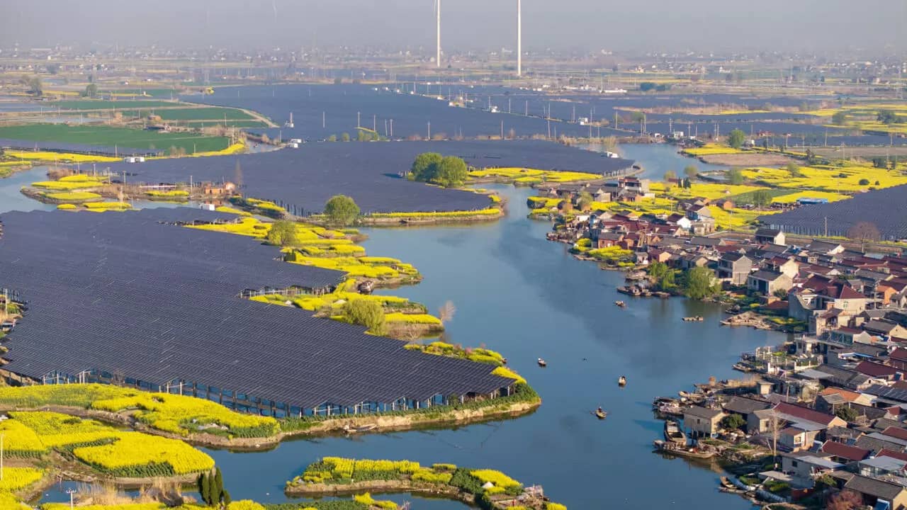 Massive solar panel installations on patches of land surrounded by water