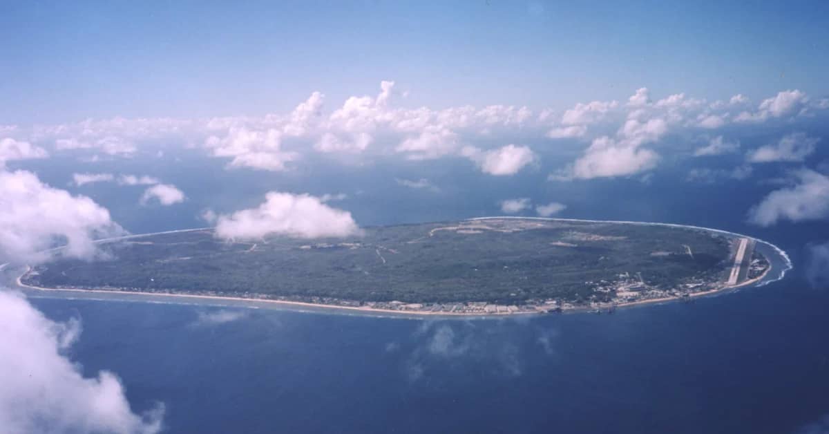 An aerial photo of a pear-shaped island surrounded by water