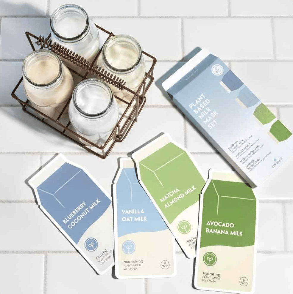 A pile of milk mask packages on white subway tile