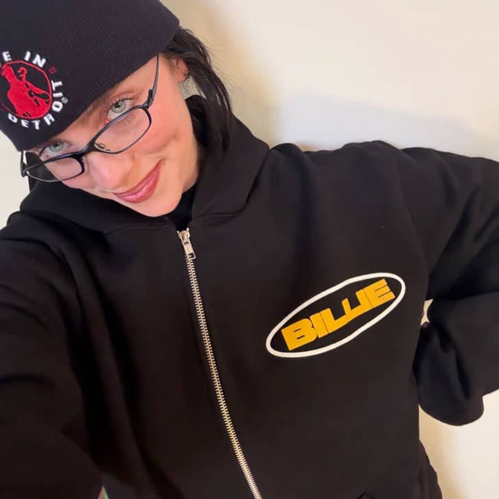 Selfie of Billie Eilish in her merch hoodie