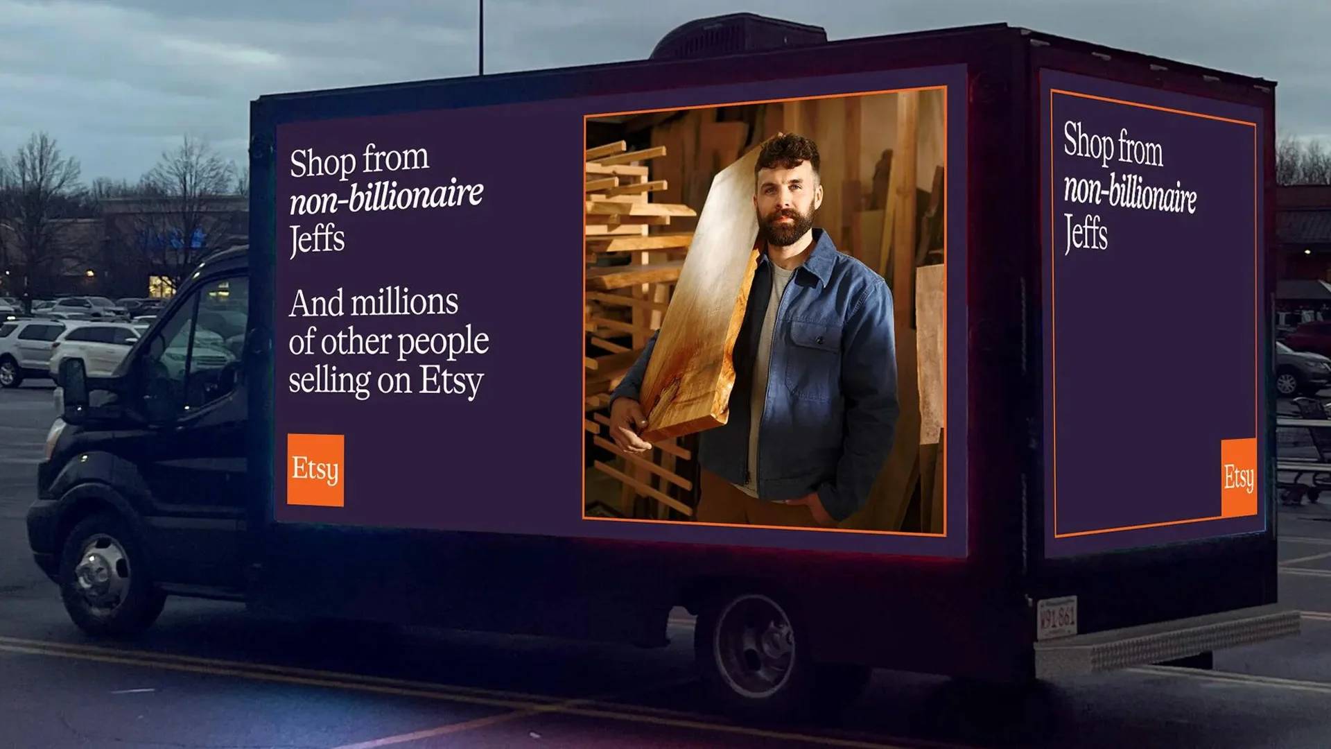 A semi truck with images on the sides that say "shop from non-billionaire jeffs and millions of other people selling on Etsy"