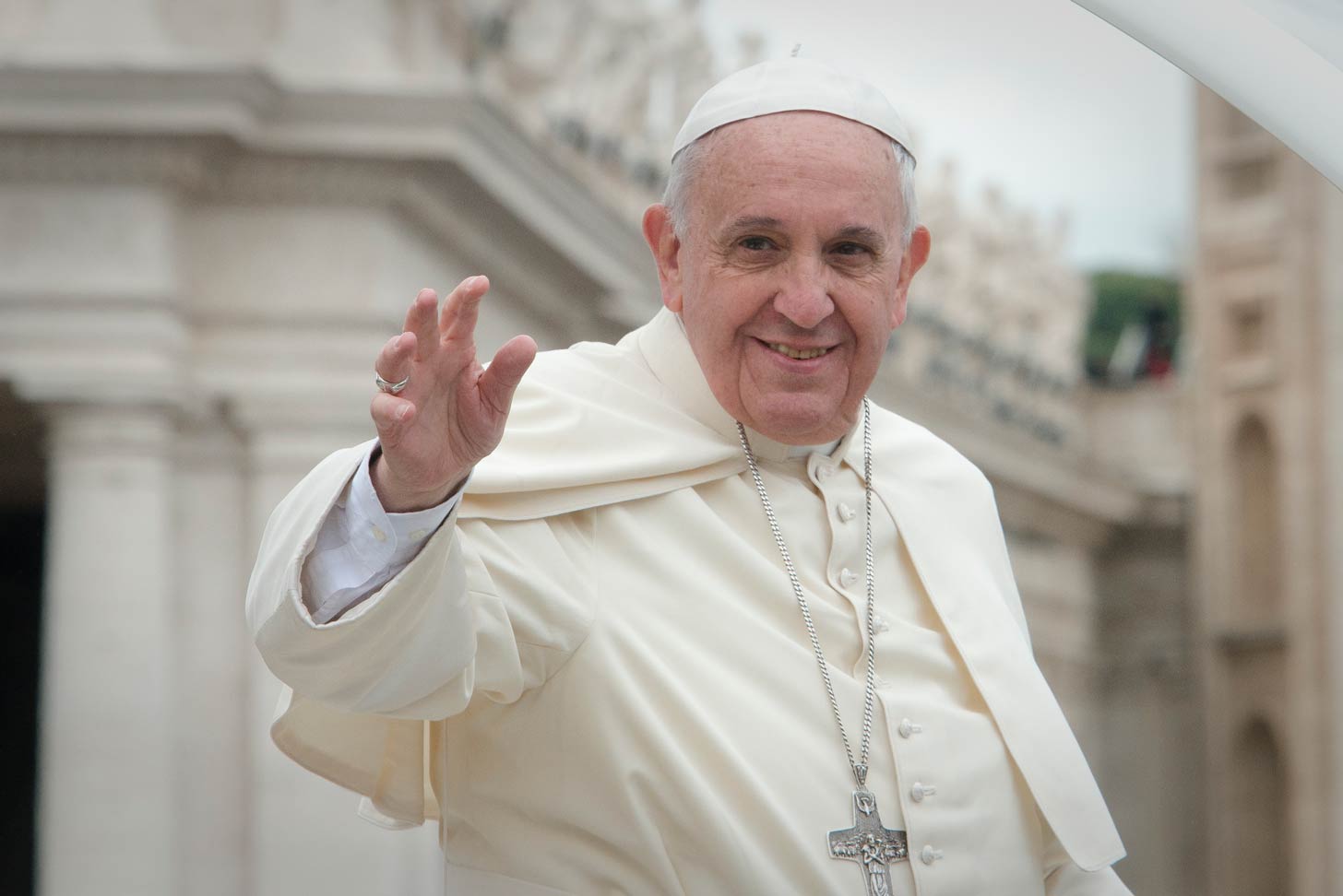 Pope Francis smiling and waving