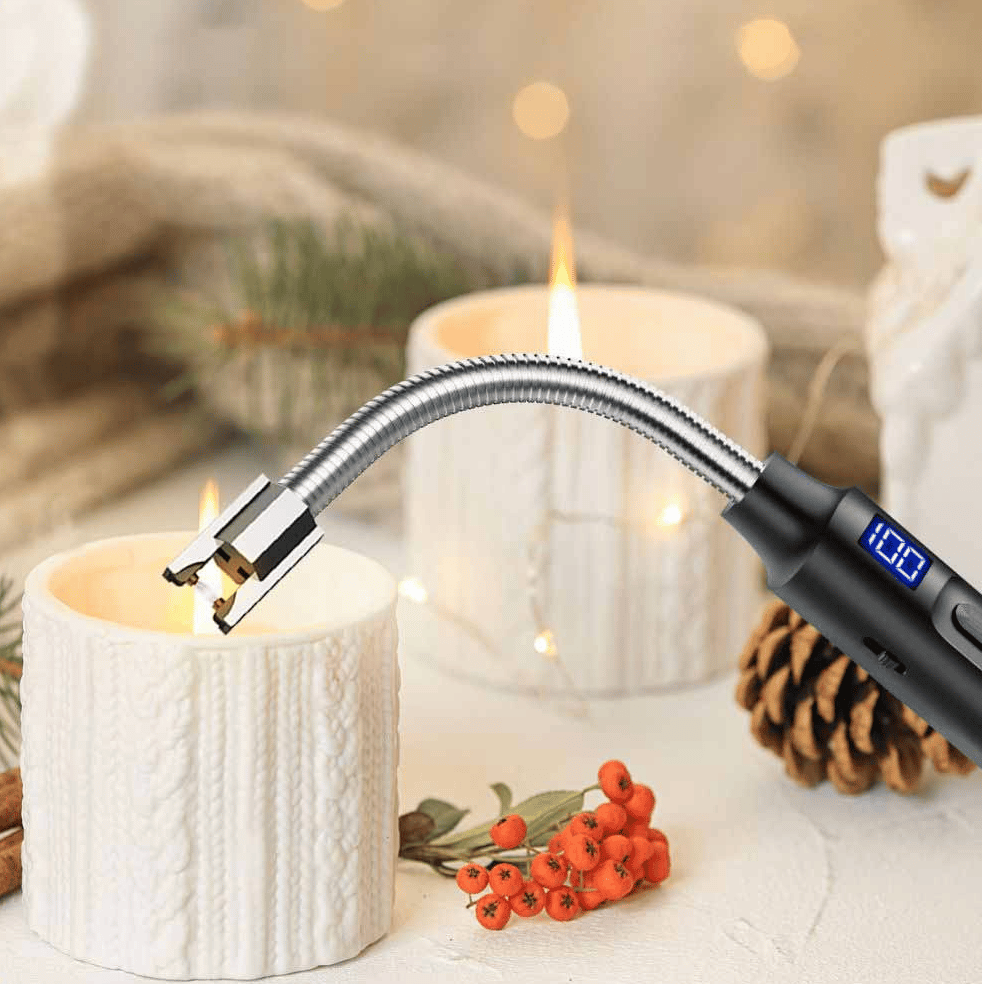 A lighter lighting a candle