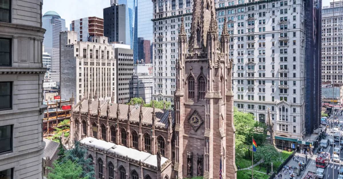 Top of a church building with buildings around it