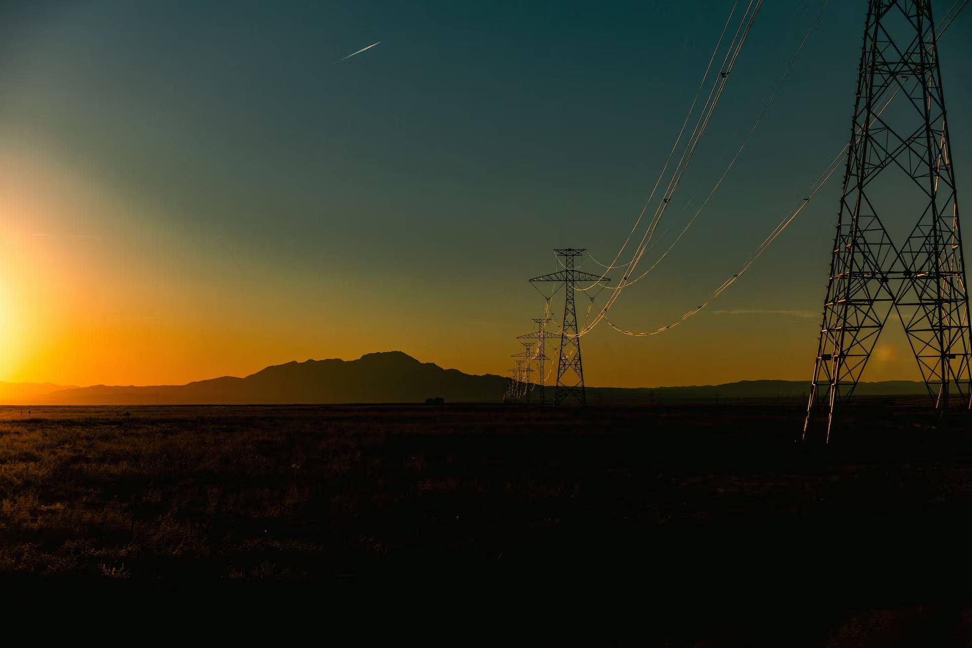 Wind turbines over a fading sunset