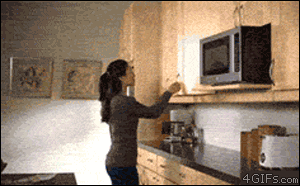A woman pulling a container from the cupboard and an avalanche of containers fall on her