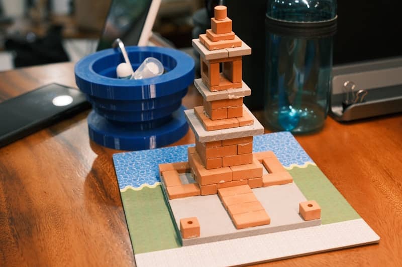 Miniature brick tower model on a desk