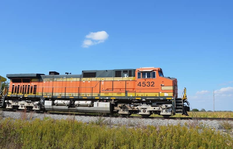 Orange train engine numbered 4532 on tracks.
