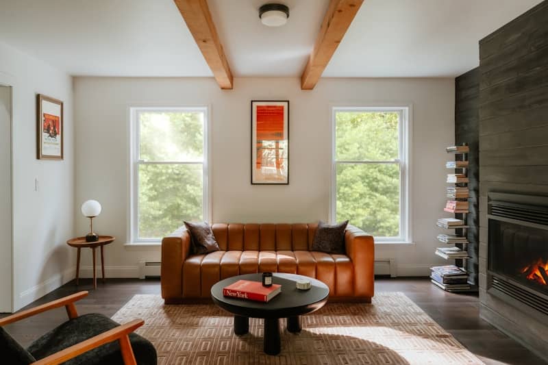 Cozy living room with leather sofa and fireplace