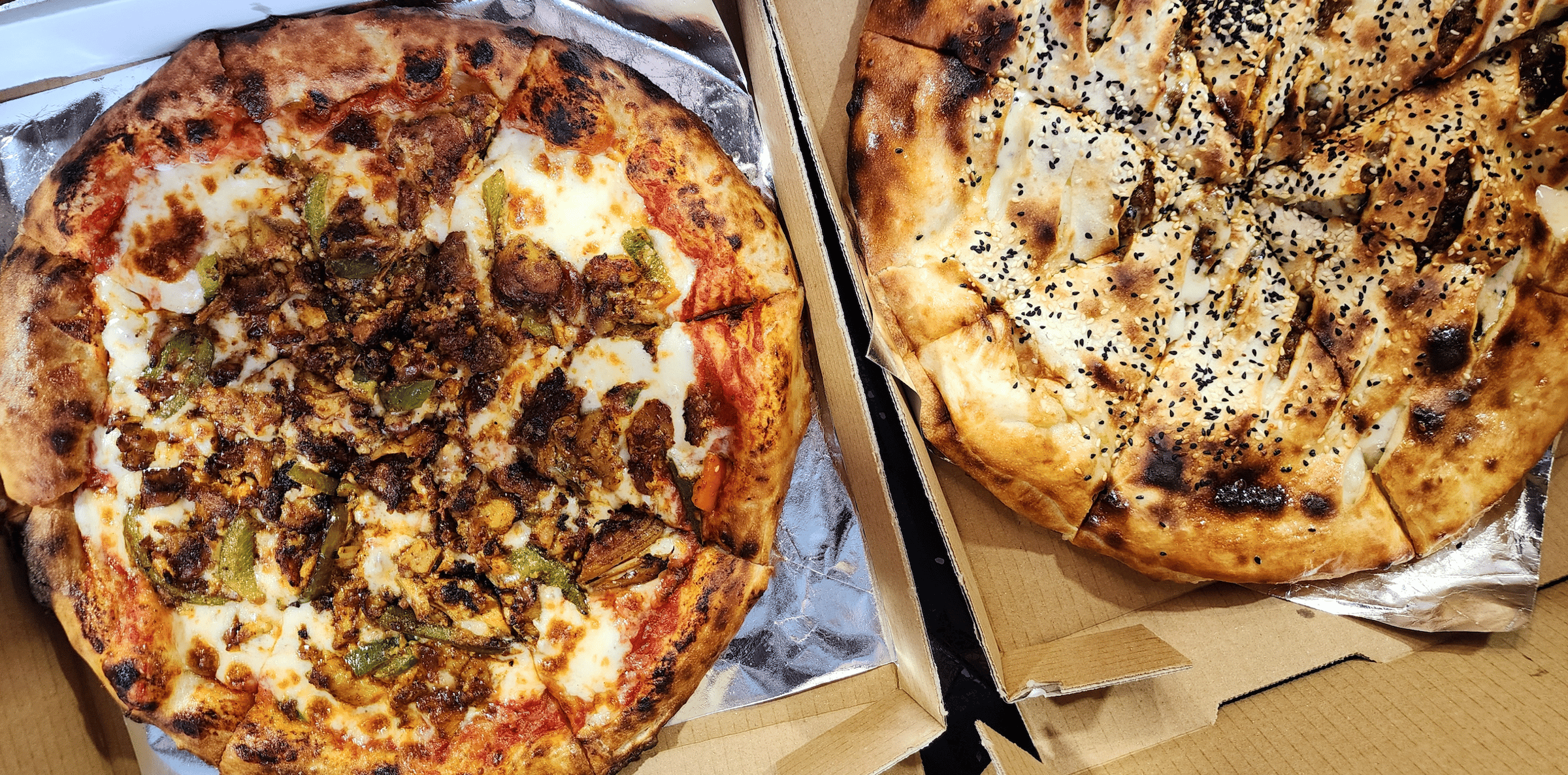 Two Timmy's Tanur pizzas side by side