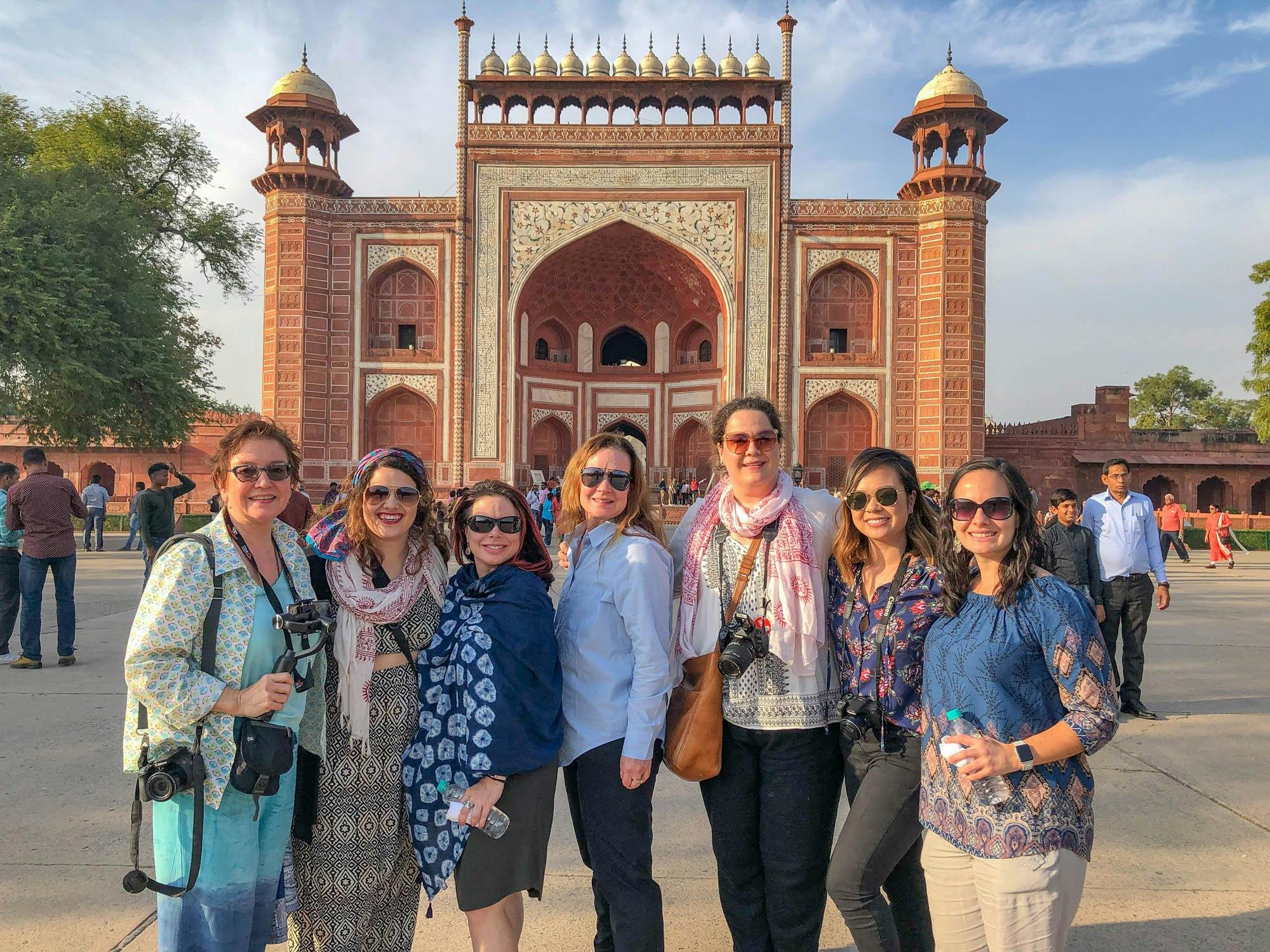 Seven Wanderful community members pose during a trip to India