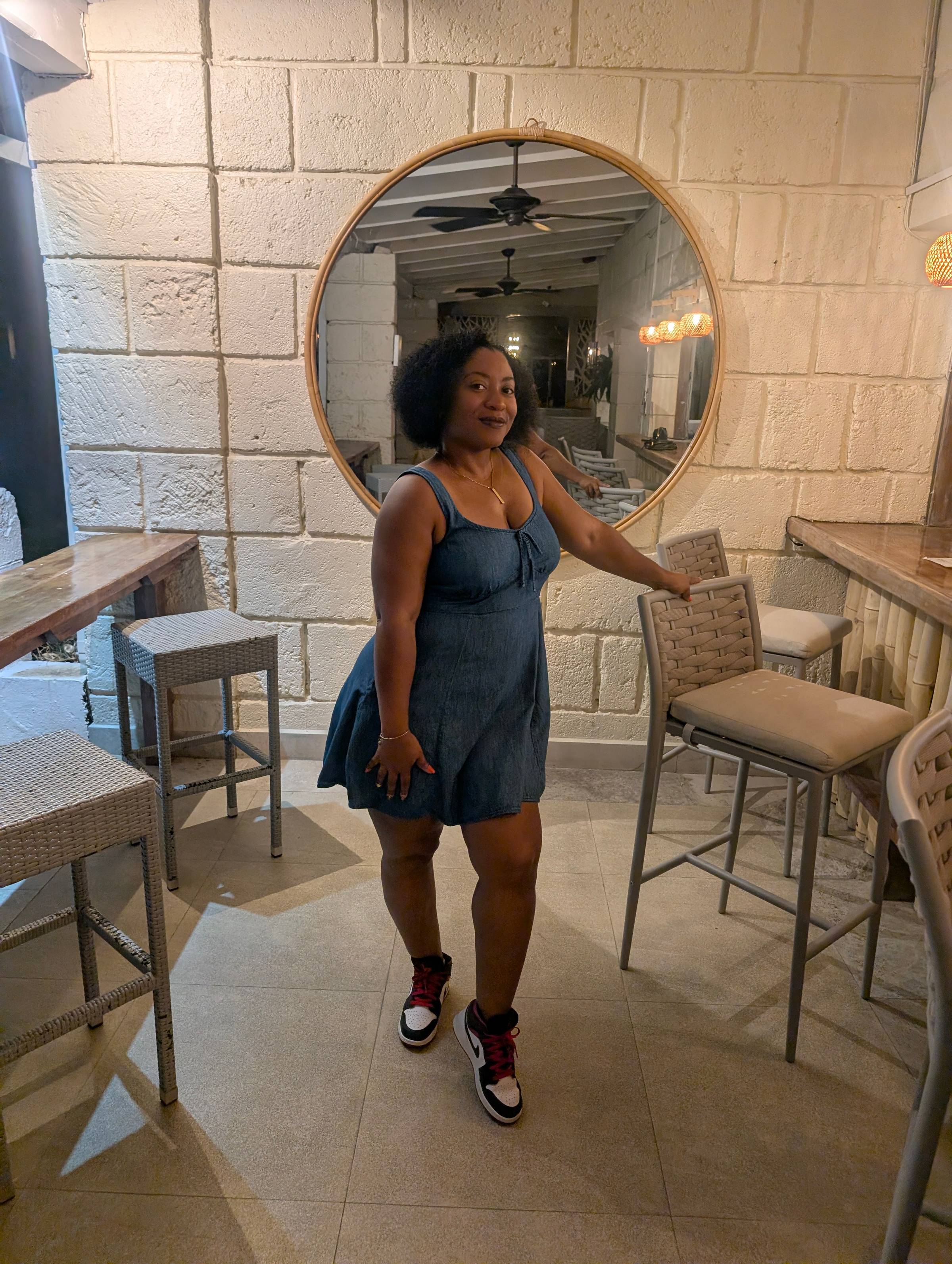 Photo of De'Christia Shavonne in a denim dress at All Seasons Europa Resort in Barbados