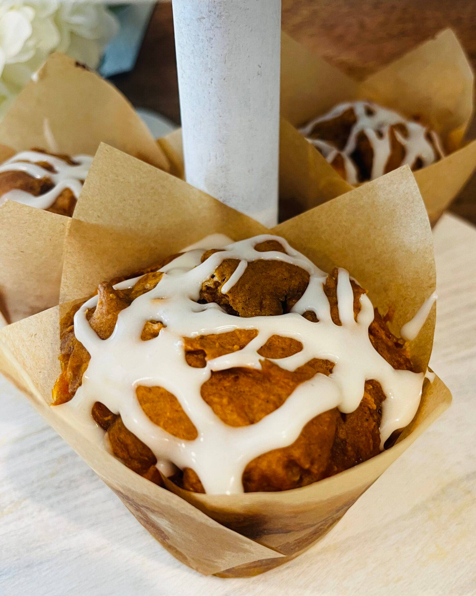 a jumbo pumpkin muffin with glaze
