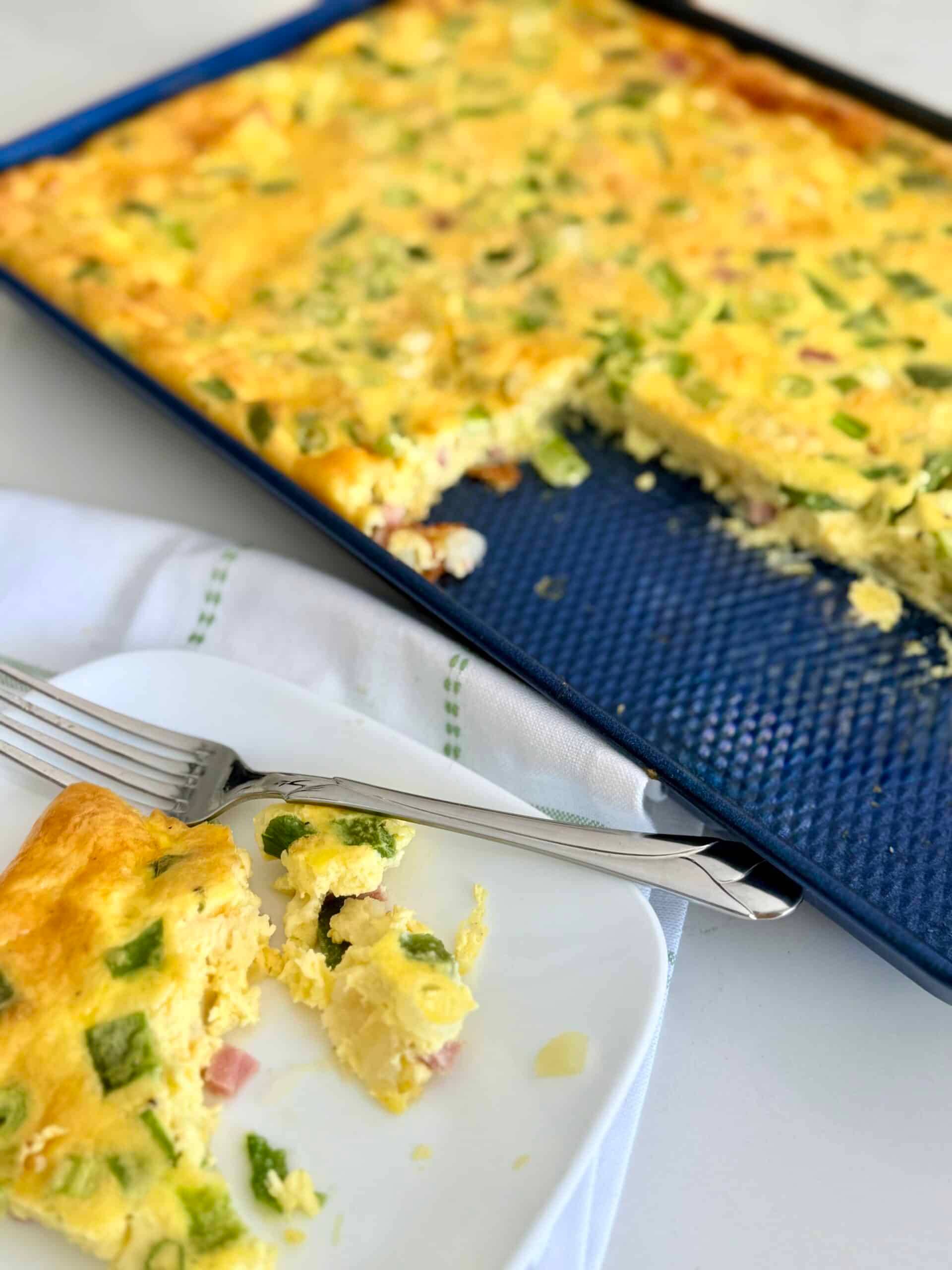 sheet pan denver omelette on a plate with a fork
