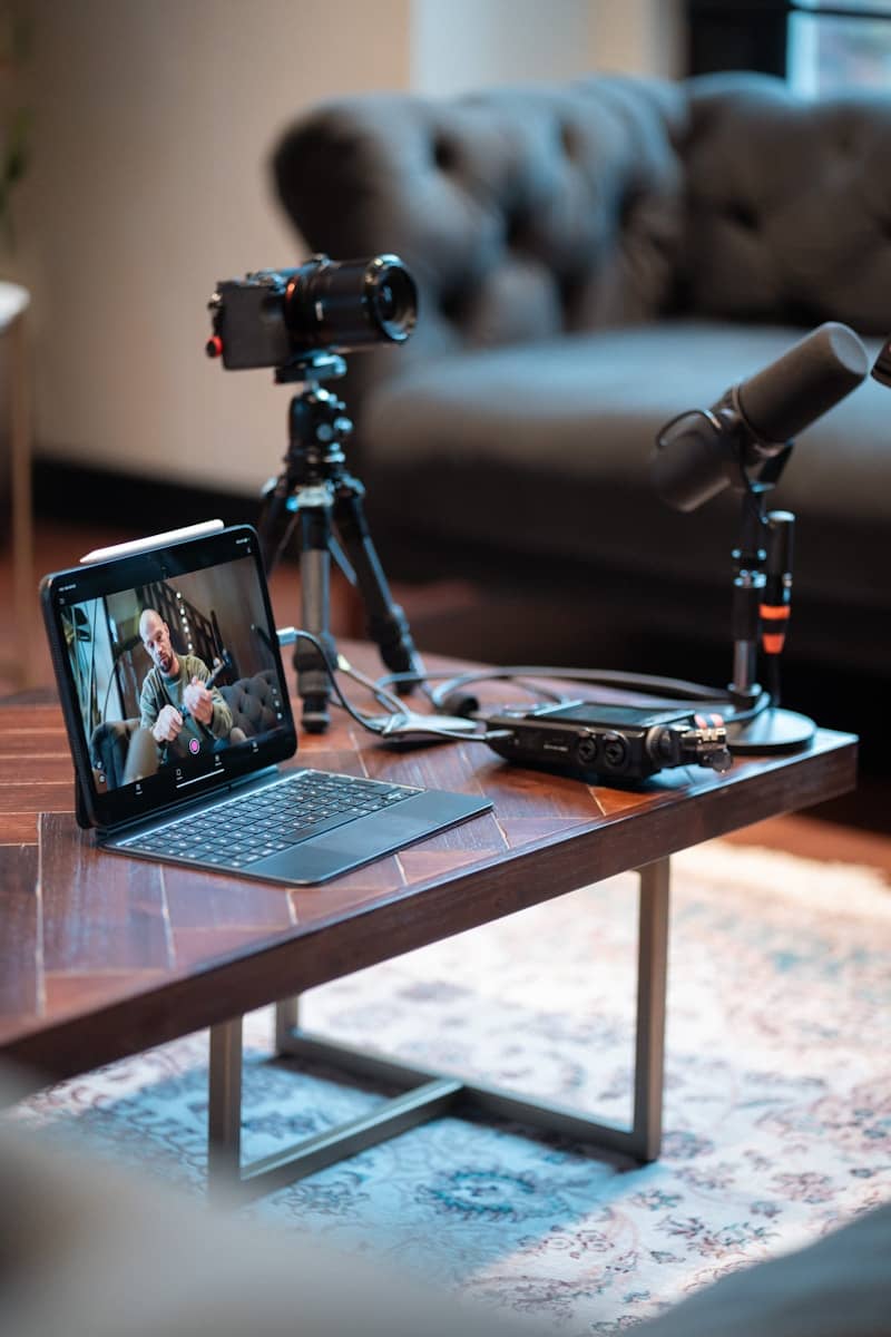 Interview preparation setup with camera, microphones, and tablet.