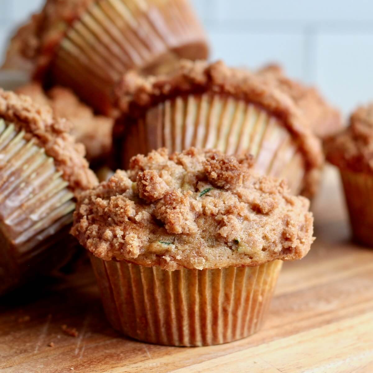 Sourdough zucchini muffins on a countertop.