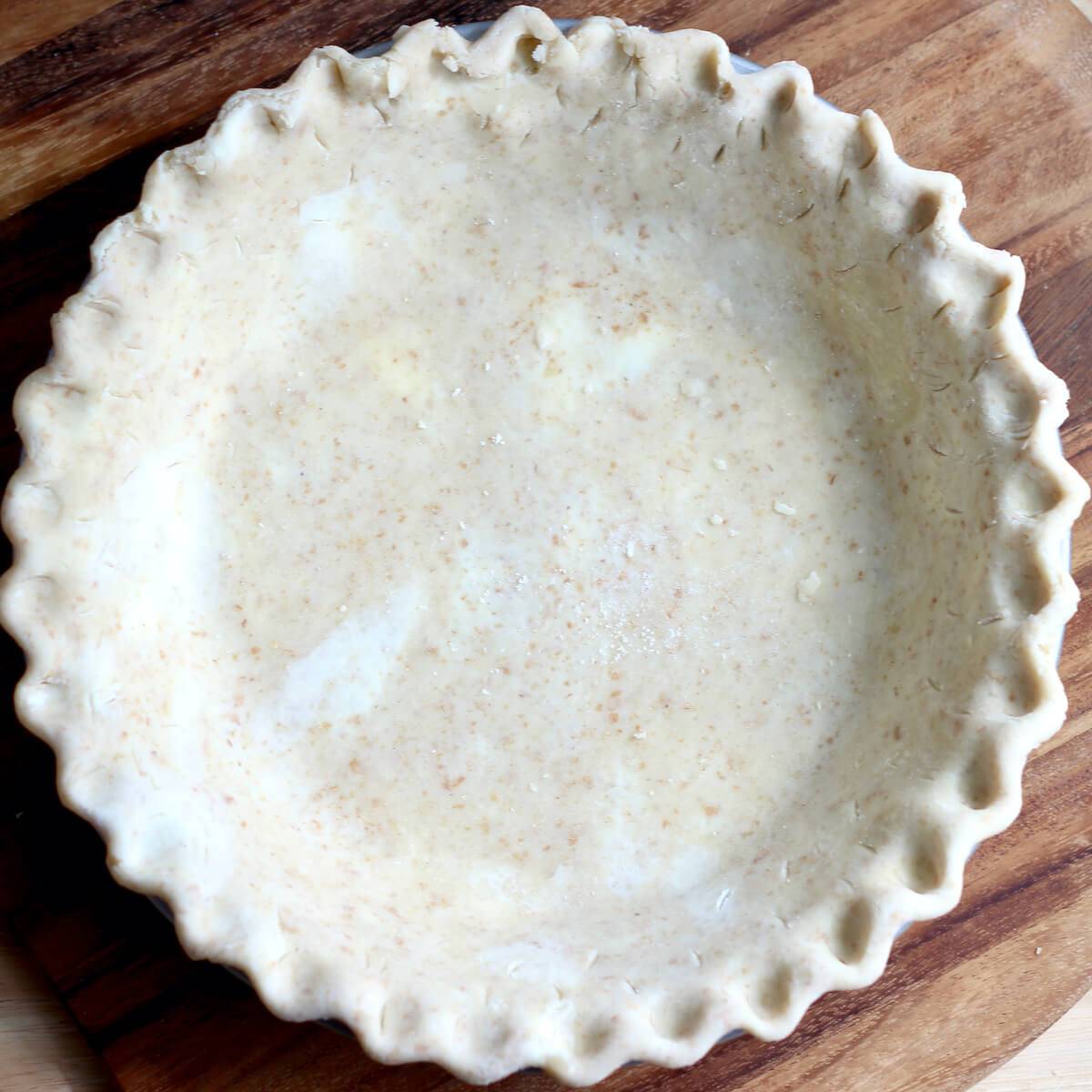 Sourdough discard pie crust in a pie plate.