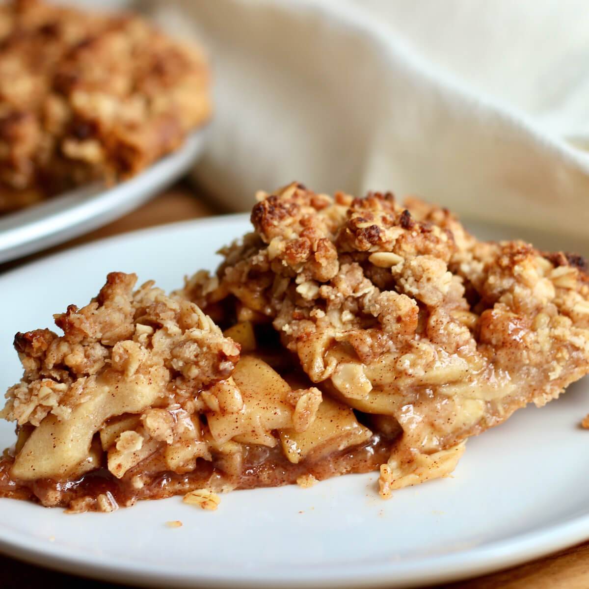 A slice of sourdough apple pie on a plate.