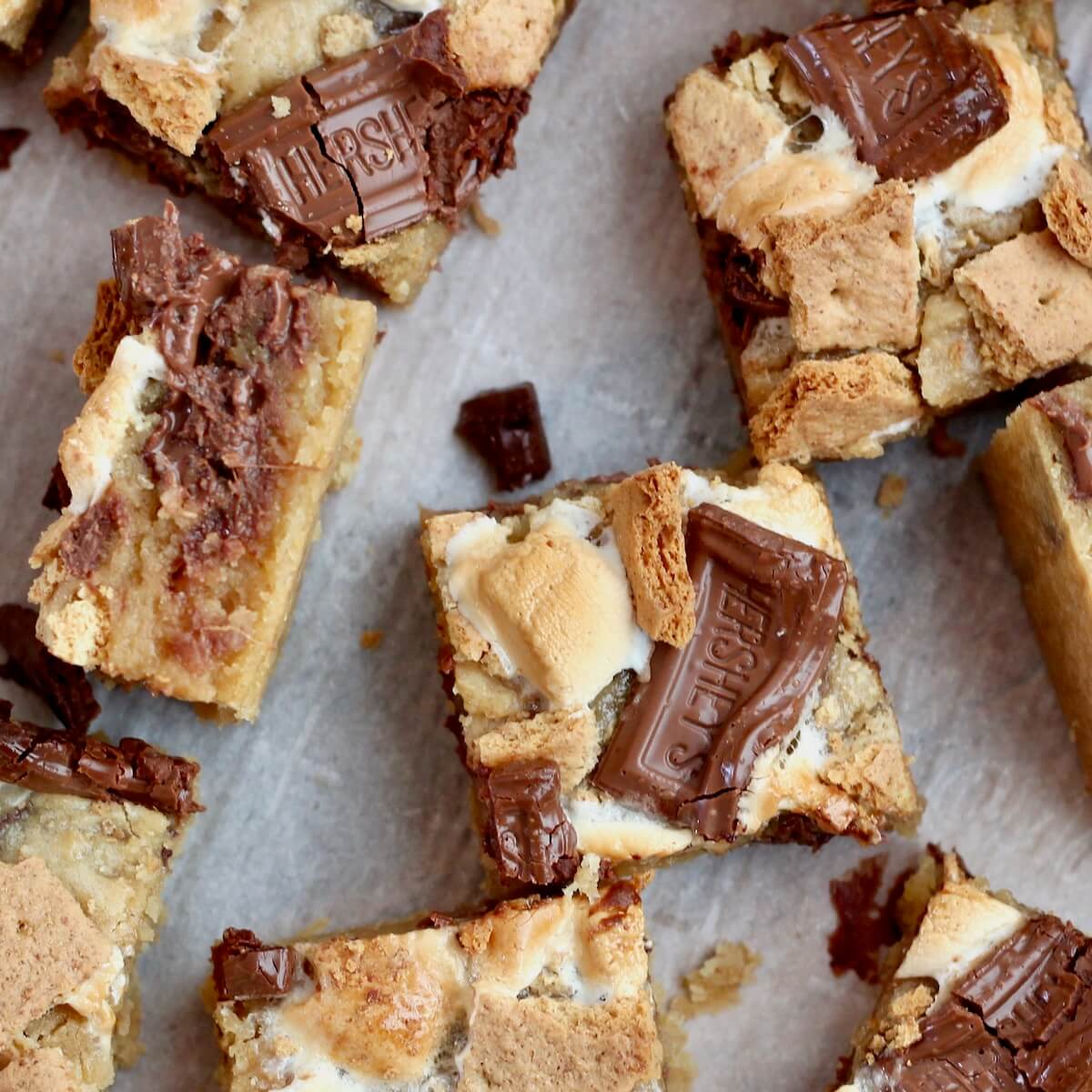 Several sourdough s'mores bars on a piece of parchment paper.