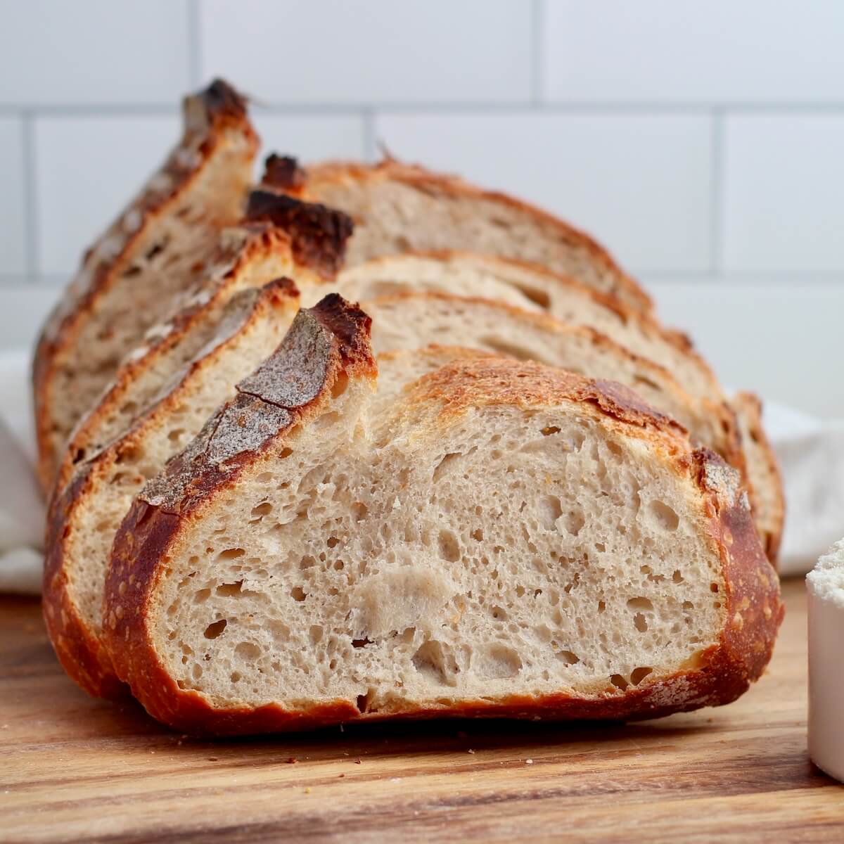A sliced loaf of high-protein sourdough bread.