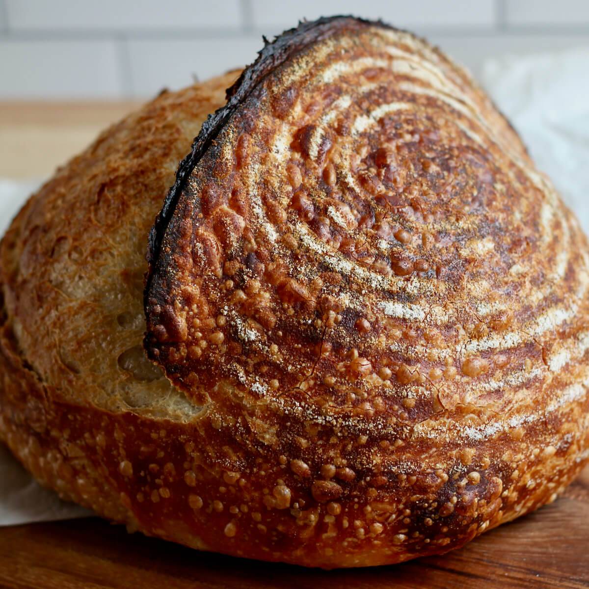 A whole loaf of basic sourdough bread.