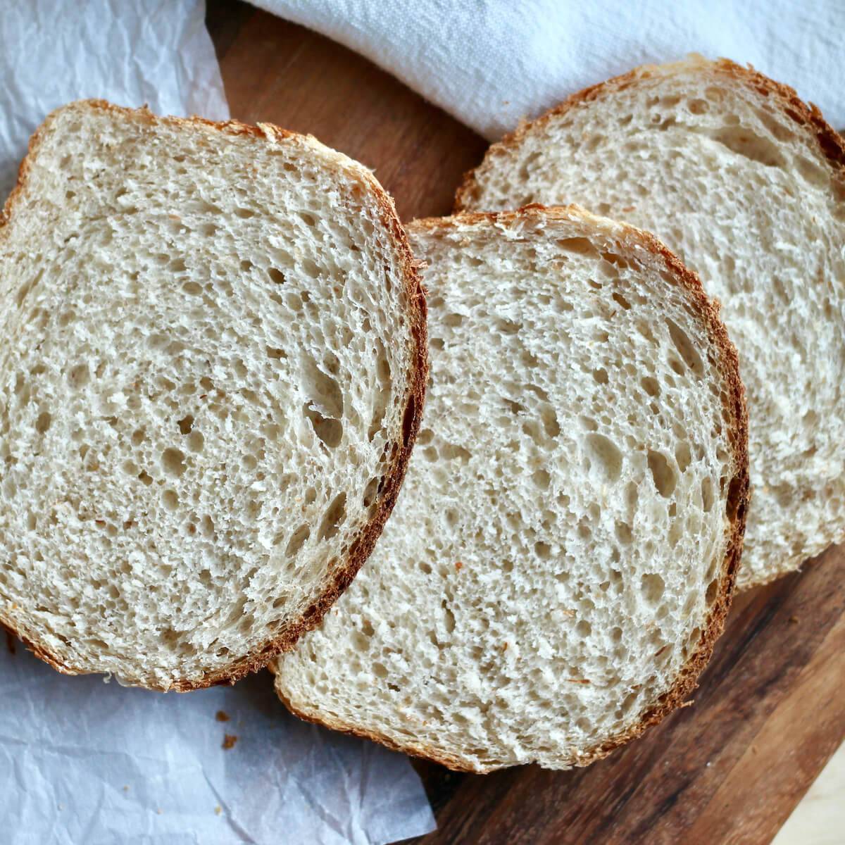 Three slices of sourdough sandwich bread.