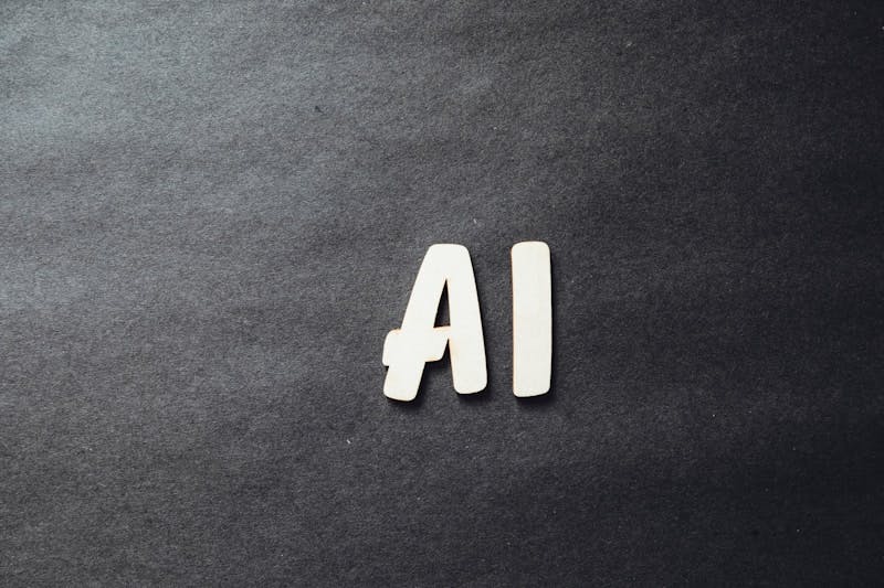 The letters AI in white on a black background.