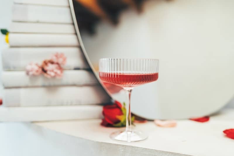 A glass of wine sitting on top of a table