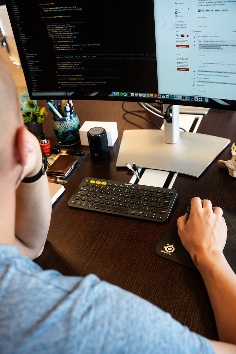 A man sitting at a desk with a computer