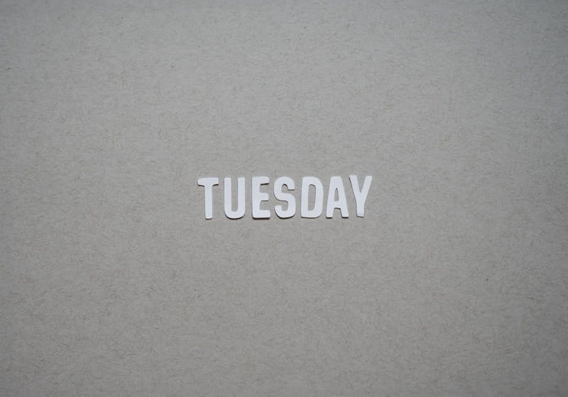 the word tuesday written in cut out letters