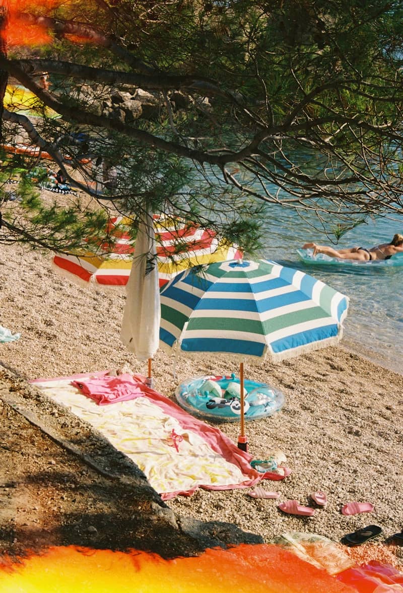 A beach with a lot of umbrellas on it