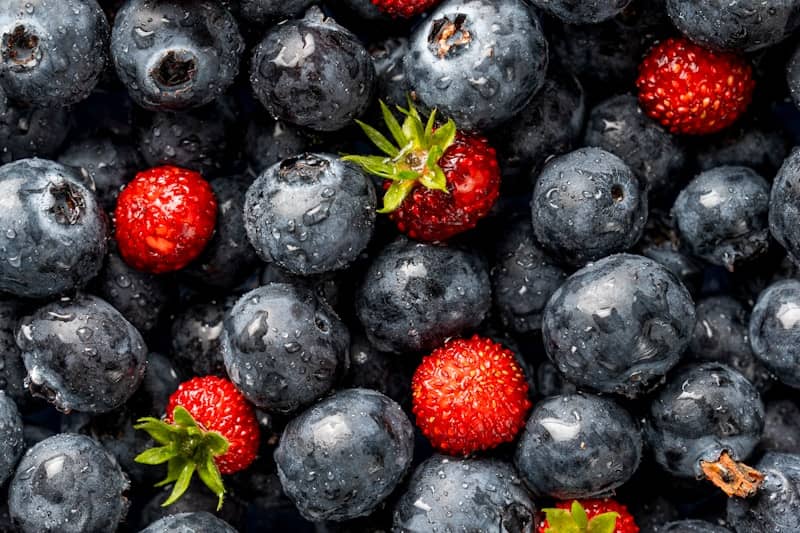 Blueberries and strawberries, a colorful and tasty mix.