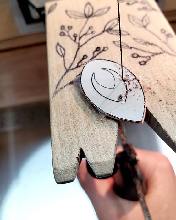Sawing an "orchid" teardrop earring from sheet metal.