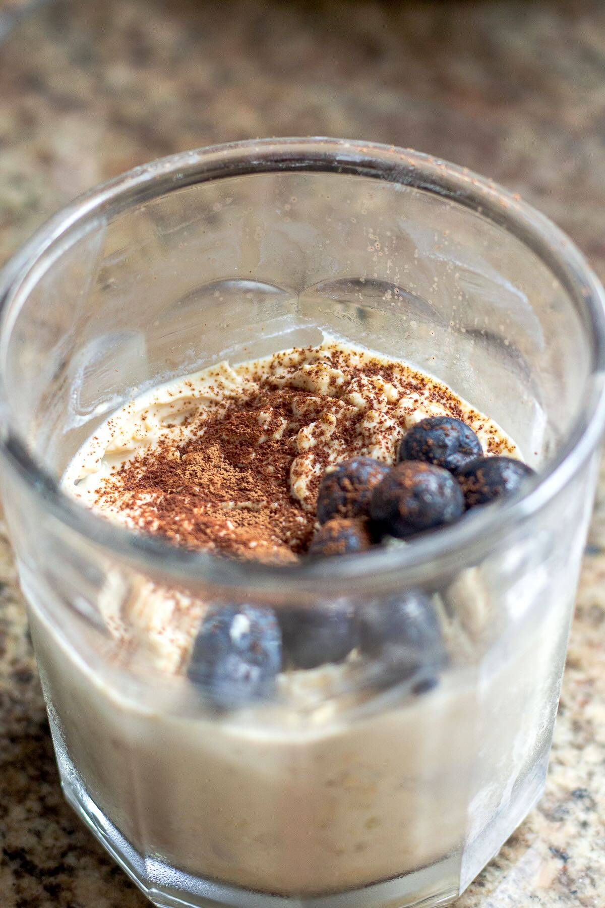 Overnight oats with protein powder served in a cup