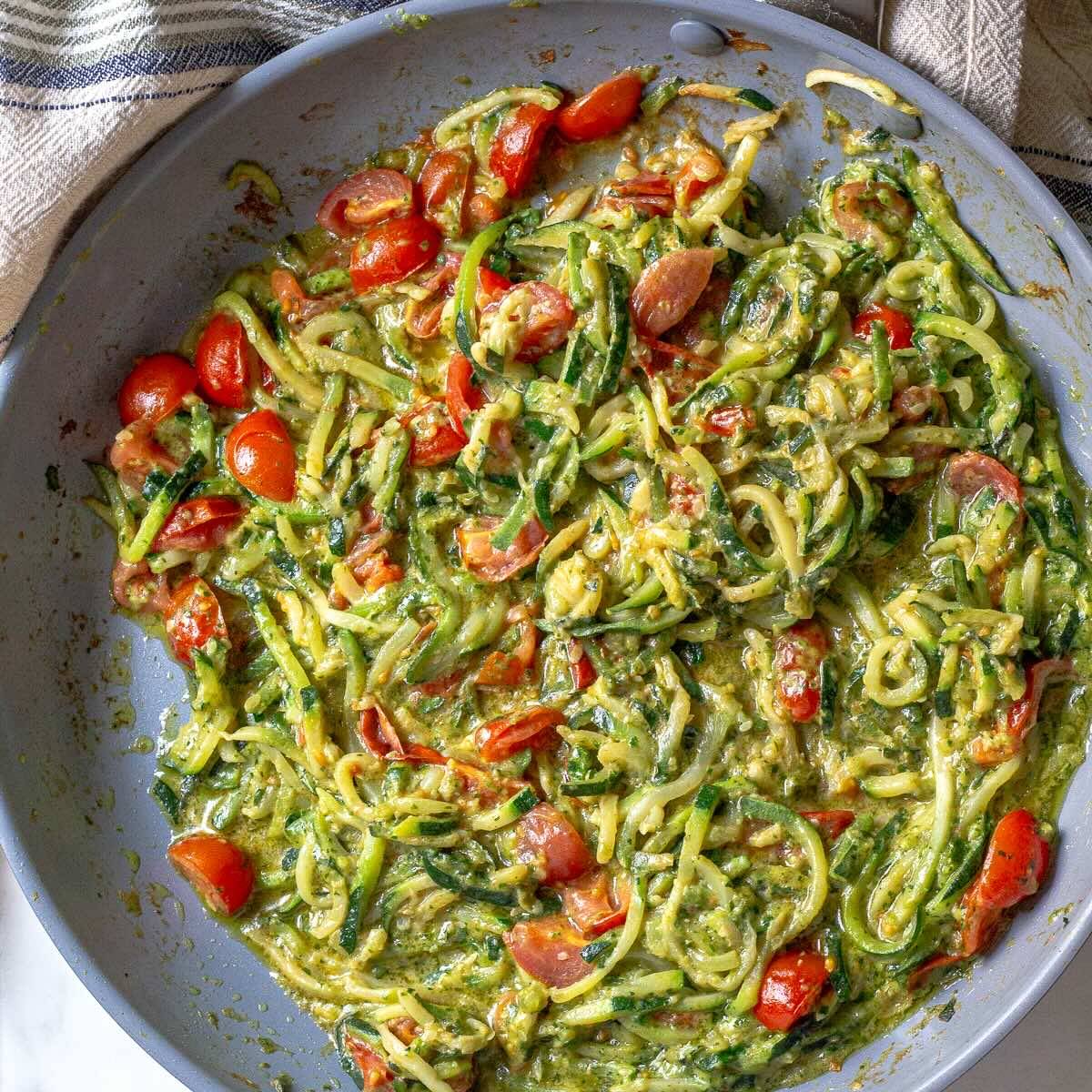 Zucchini Noodles with Nut-Free Pesto shown right after being cooked in the skillet