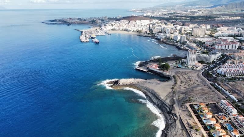 Aerial view of a scenic coastal city.