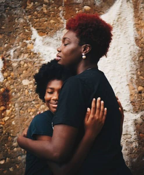 two women hugging each other