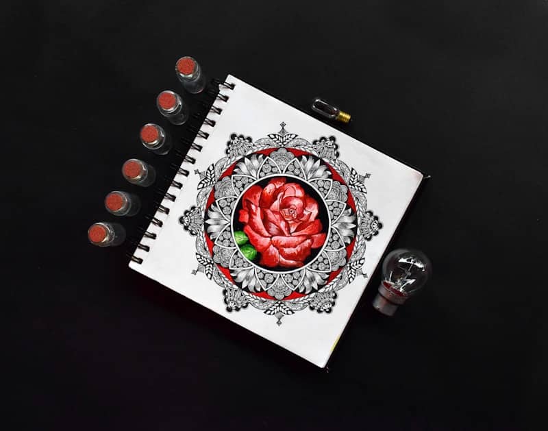 red rose on white paper