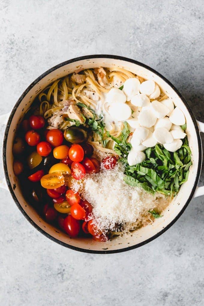 One pot chicken bruschetta pasta with tomaotes, basil, and cheese and noodles.