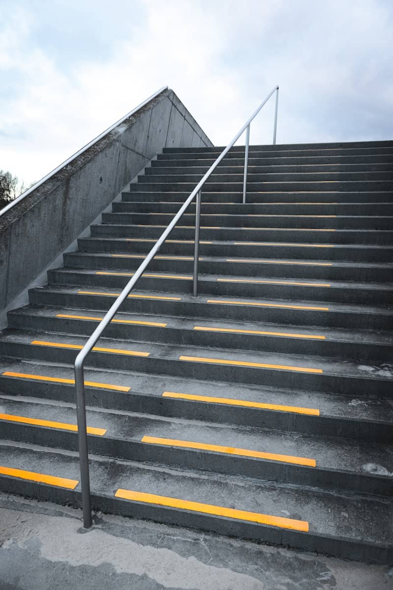 A set of stairs leading up to the top of a flight of stairs