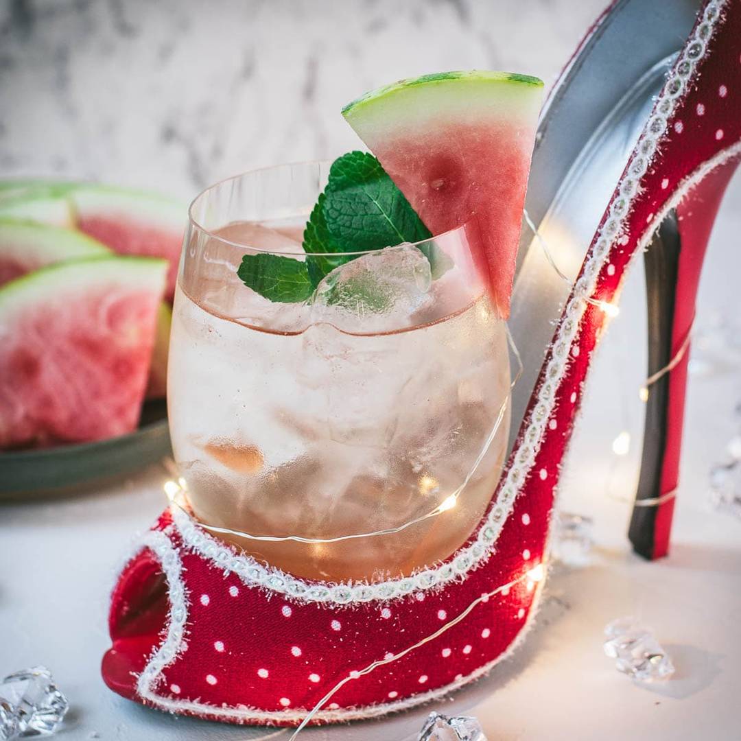Refreshing watermelon spritz with ice, bubbles, and a summery garnish, linking to the recipe.