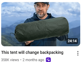 man easily holding rolled up tent