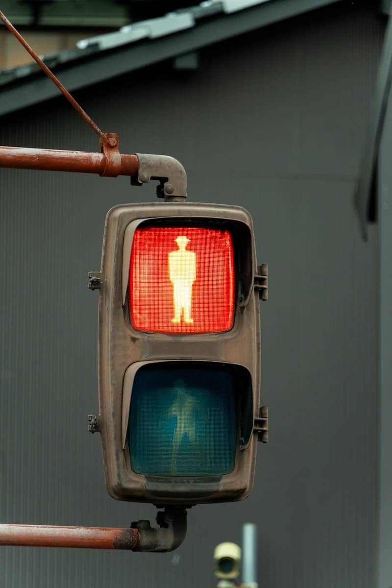 A traffic light with a man on it