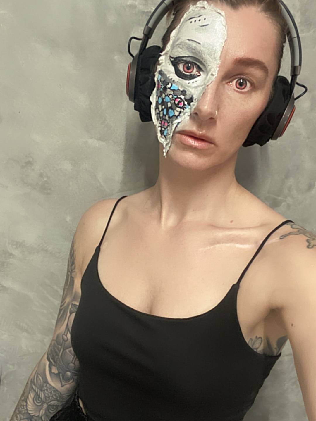 a woman with cyborg facepaint 