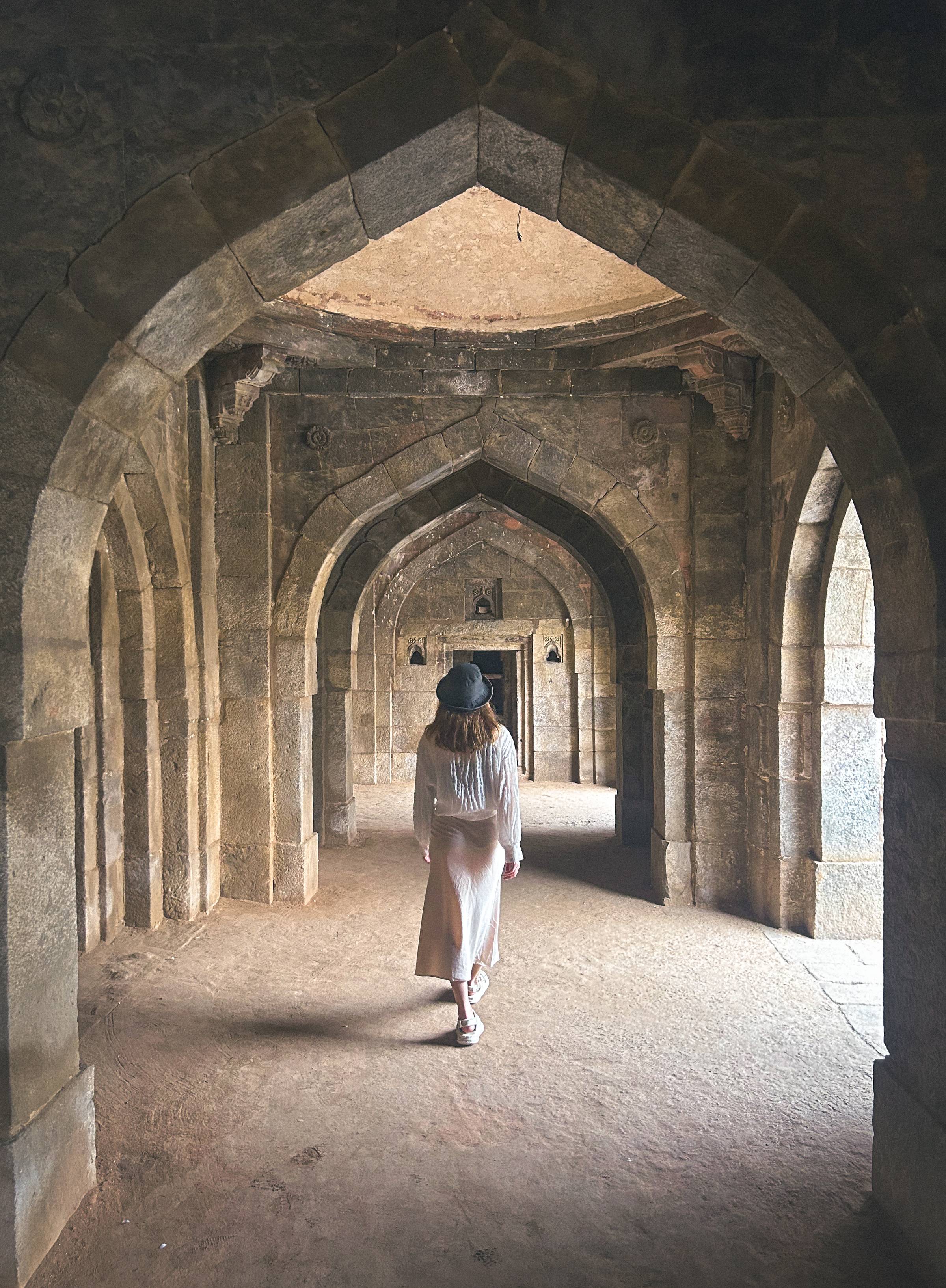 Woman walking through the ruins at Lodhi Park