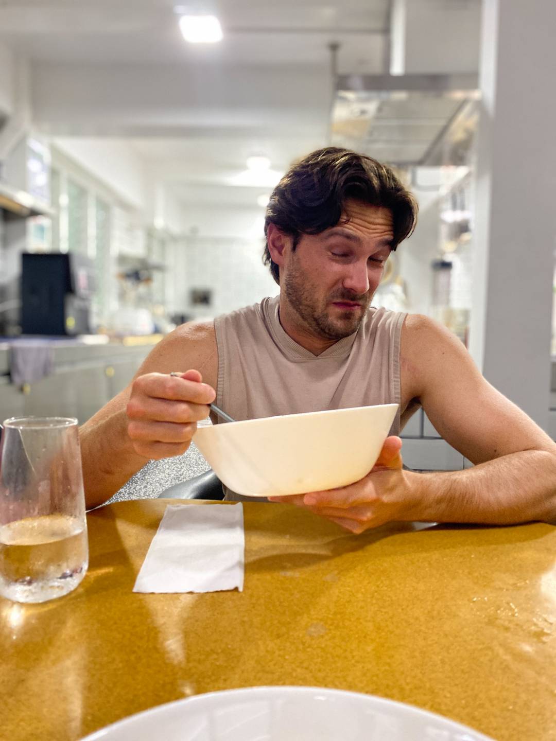 a person wincing while eating spicy food