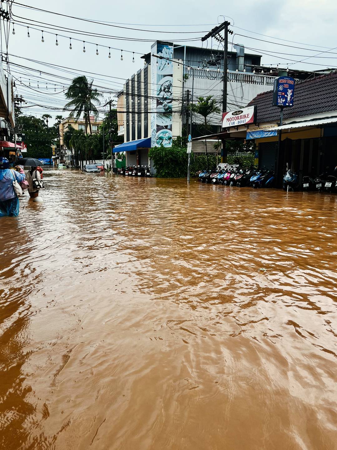 A street filled with water, after a landslide in Phuket.
