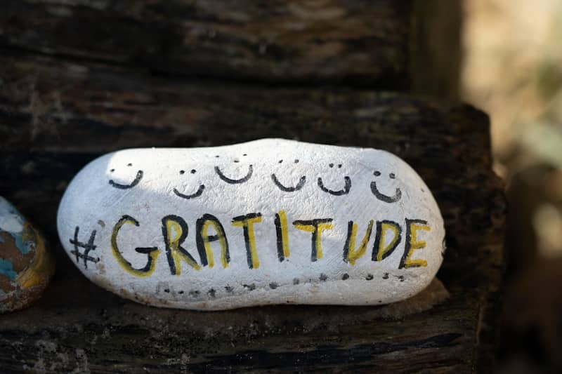 a white and yellow object with writing on it