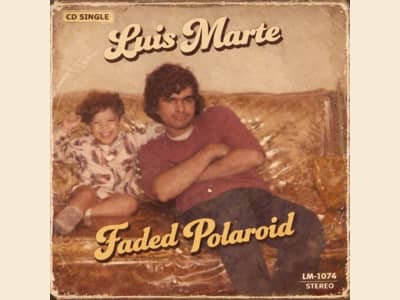“A vintage-style album cover featuring a young Luis Marte sitting beside his uncle on a gold-patterned couch, with retro textured edges and warm sepia tones. The image includes the title ‘Faded Polaroid’ and the artist name ‘Luis Marte,’ evoking nostalgia