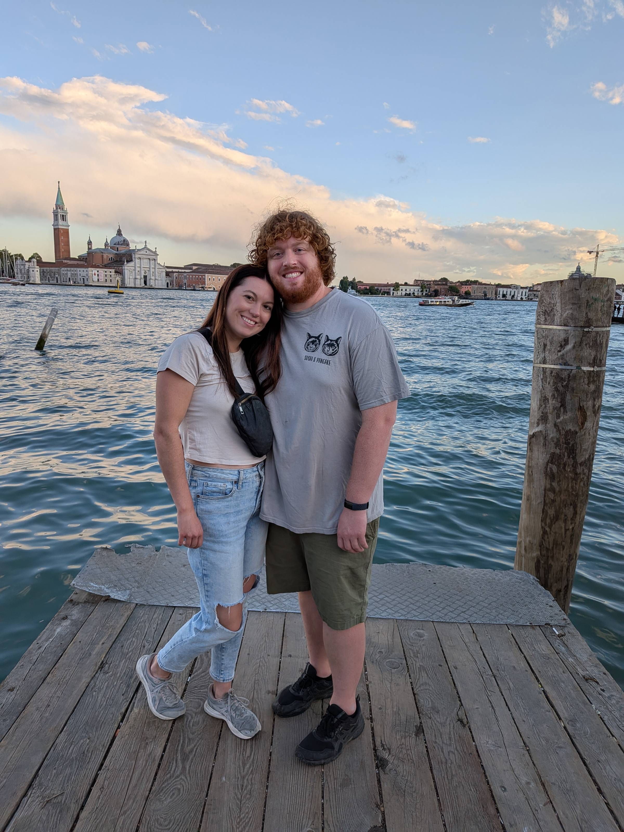 couple standing in front of water in Venice.